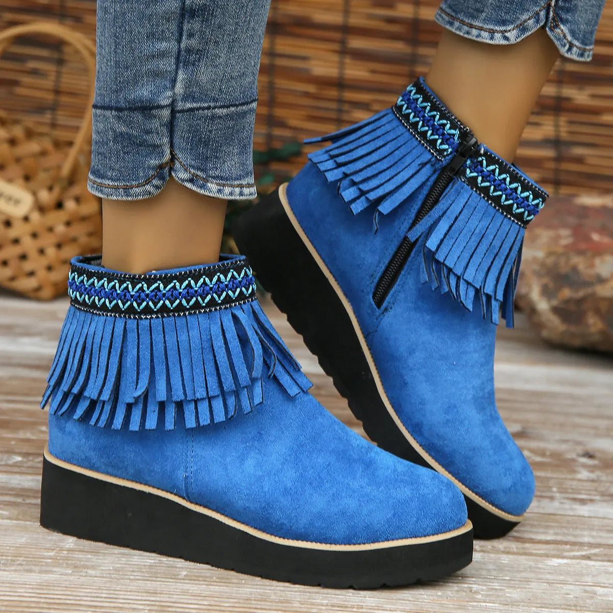 Women's suede wedge ankle boots with side zipper, thick rubber sole, and tassel detailing in dark brown colour
