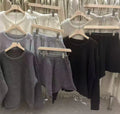 Loose-fitting knitted sweater and wide leg shorts two-piece set for women in dark gray on a plain background
