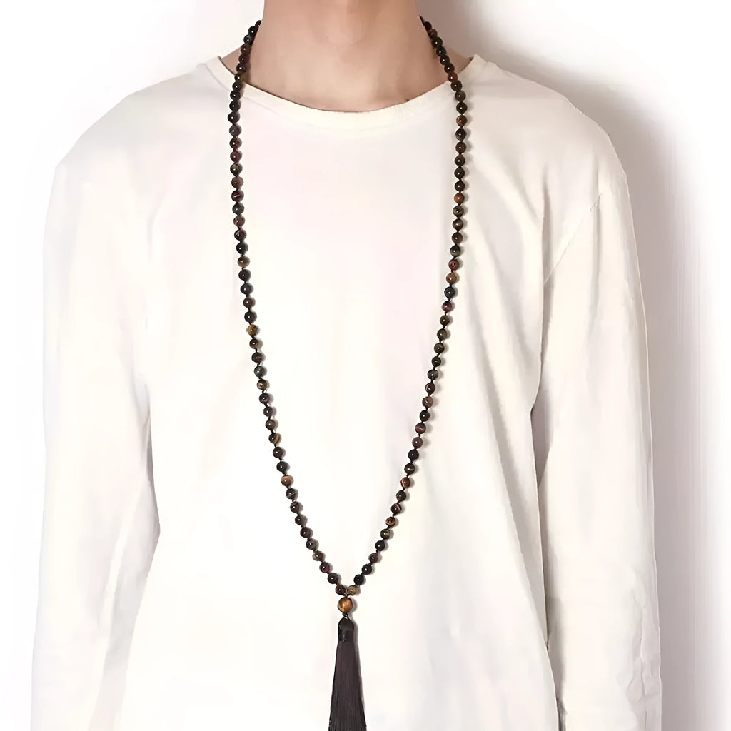 Agate amethyst blue pattern tassel necklace with geometric pendant on neutral background