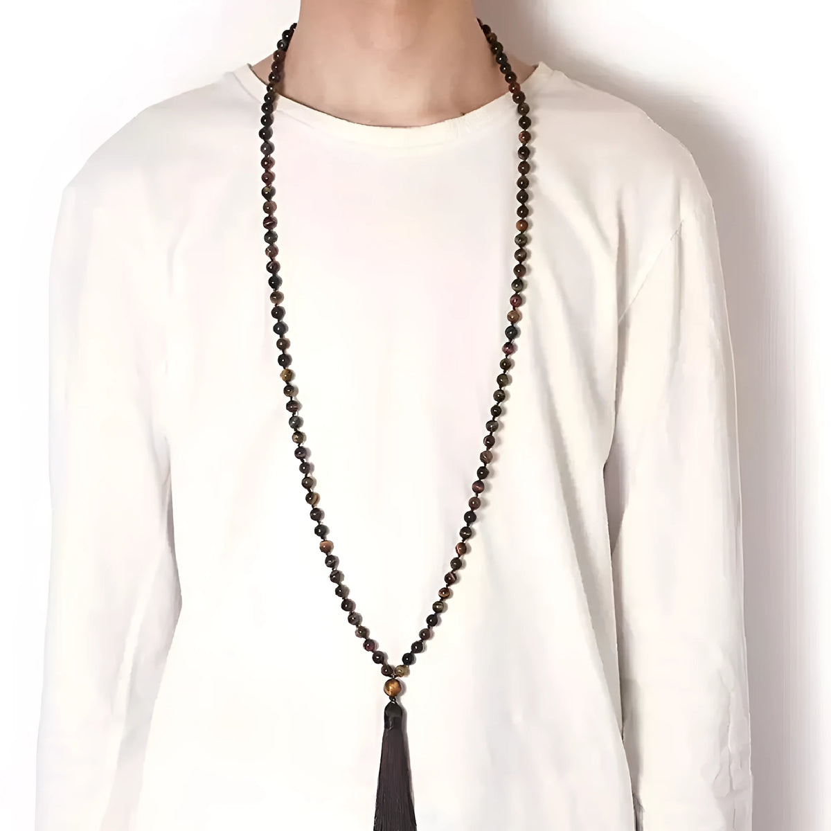 Agate amethyst blue pattern tassel necklace with geometric pendant on neutral background