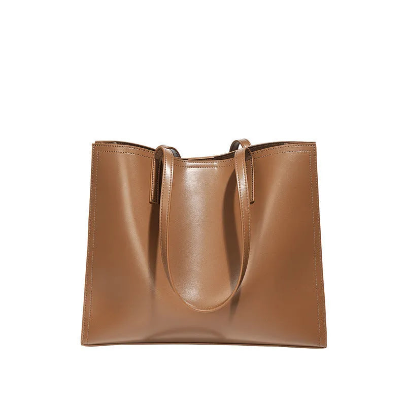Women's genuine leather one shoulder handbag in brown with sewing thread detailing and horizontal square shape