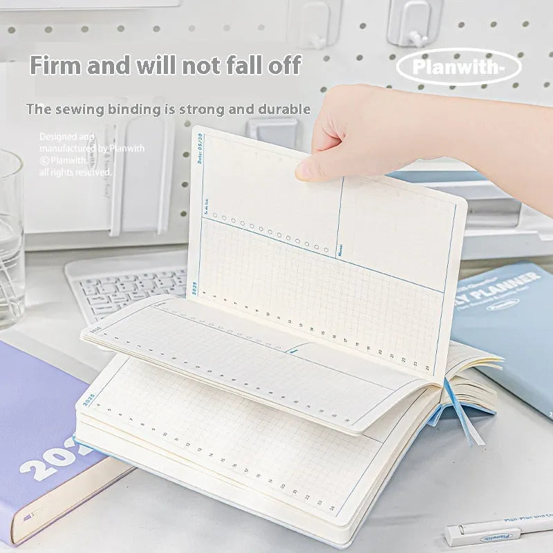Waterproof notebook with PU cover in mint green colour, open to show writing paper, for exam study clock-in records.