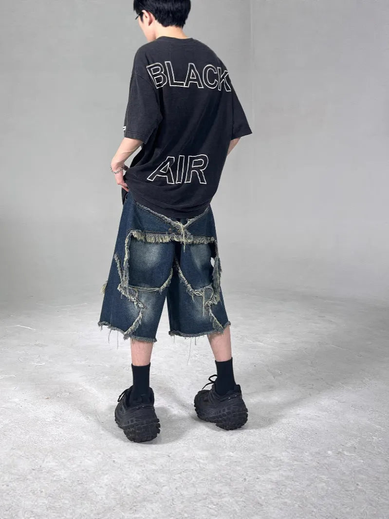Blue denim shorts with frayed five-point star detailing in retro American style, loose fit for summer