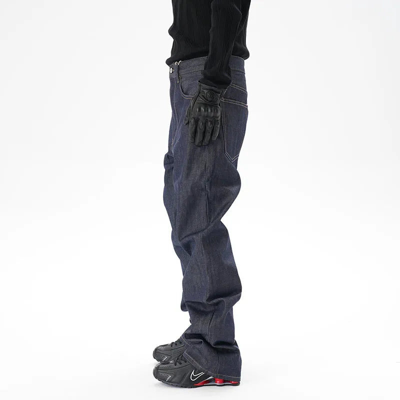 Man's dark blue loose-fit straight leg denim jeans on a neutral background.