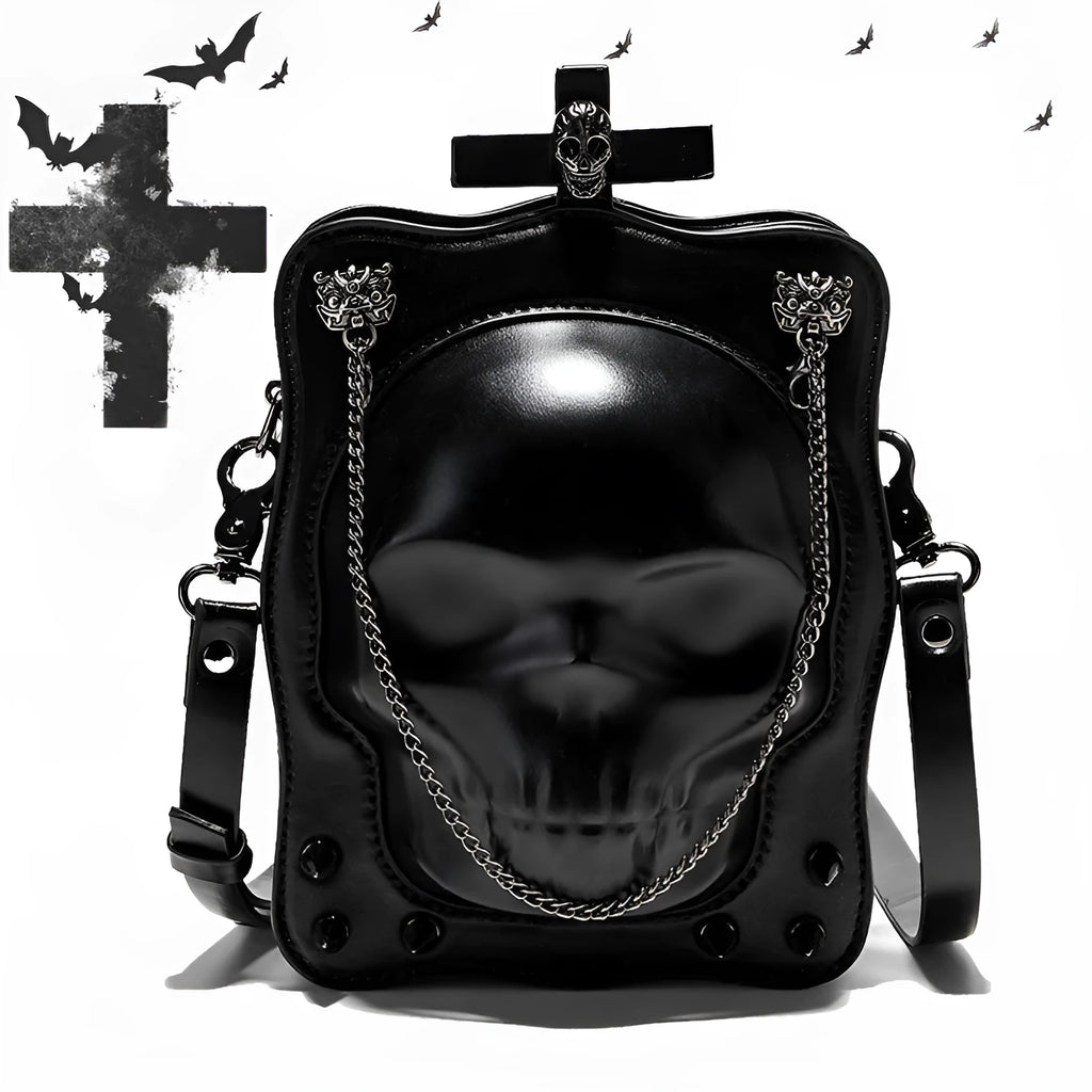 Black gothic crossbody bag with skull design, stitching, rivets, and chain details.