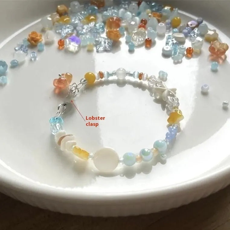 Alloy and mixed material seaside summer charm bracelet in colour Bracelet 0213 with diamond and round shapes.