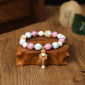 Handmade gray porcelain glazed ceramic lucky rabbit charm on an adjustable elastic bracelet