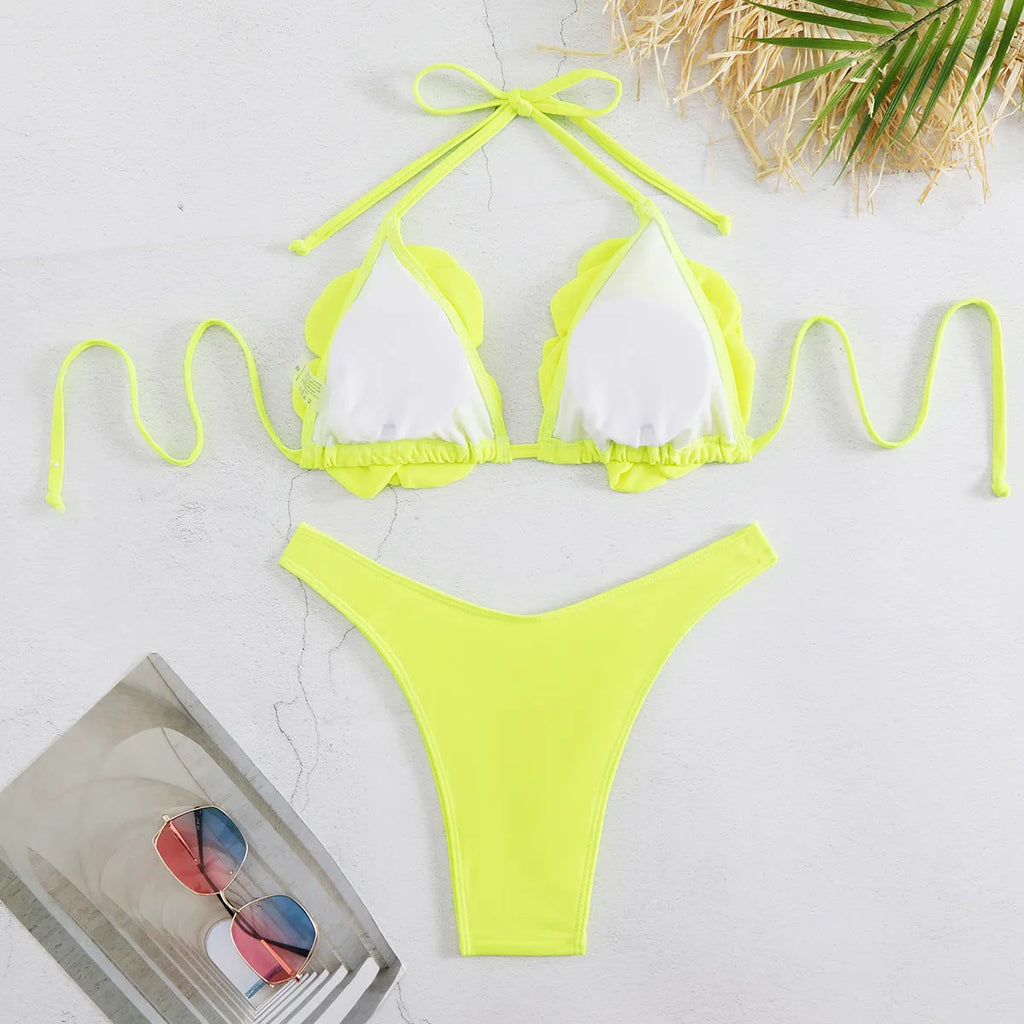 Women's low waist bikini swimsuit with 3D flower design in solid colour