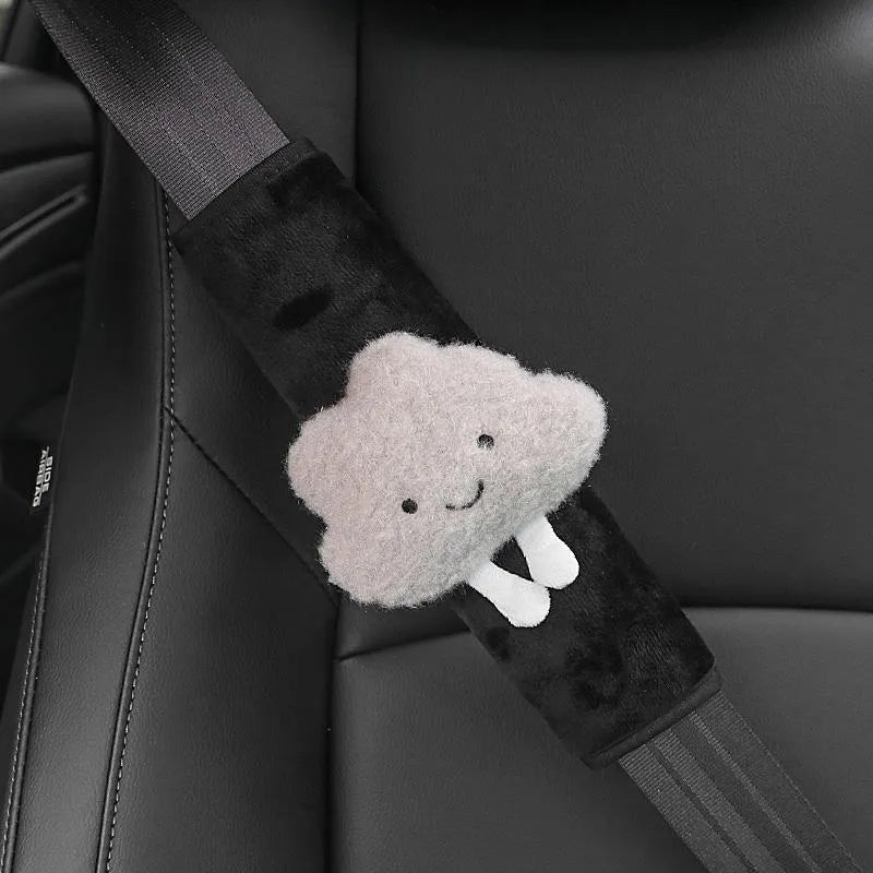 Creative cartoon plush universal automobile seat belt shoulder protector in big-eyed panda design on a grey car seat belt