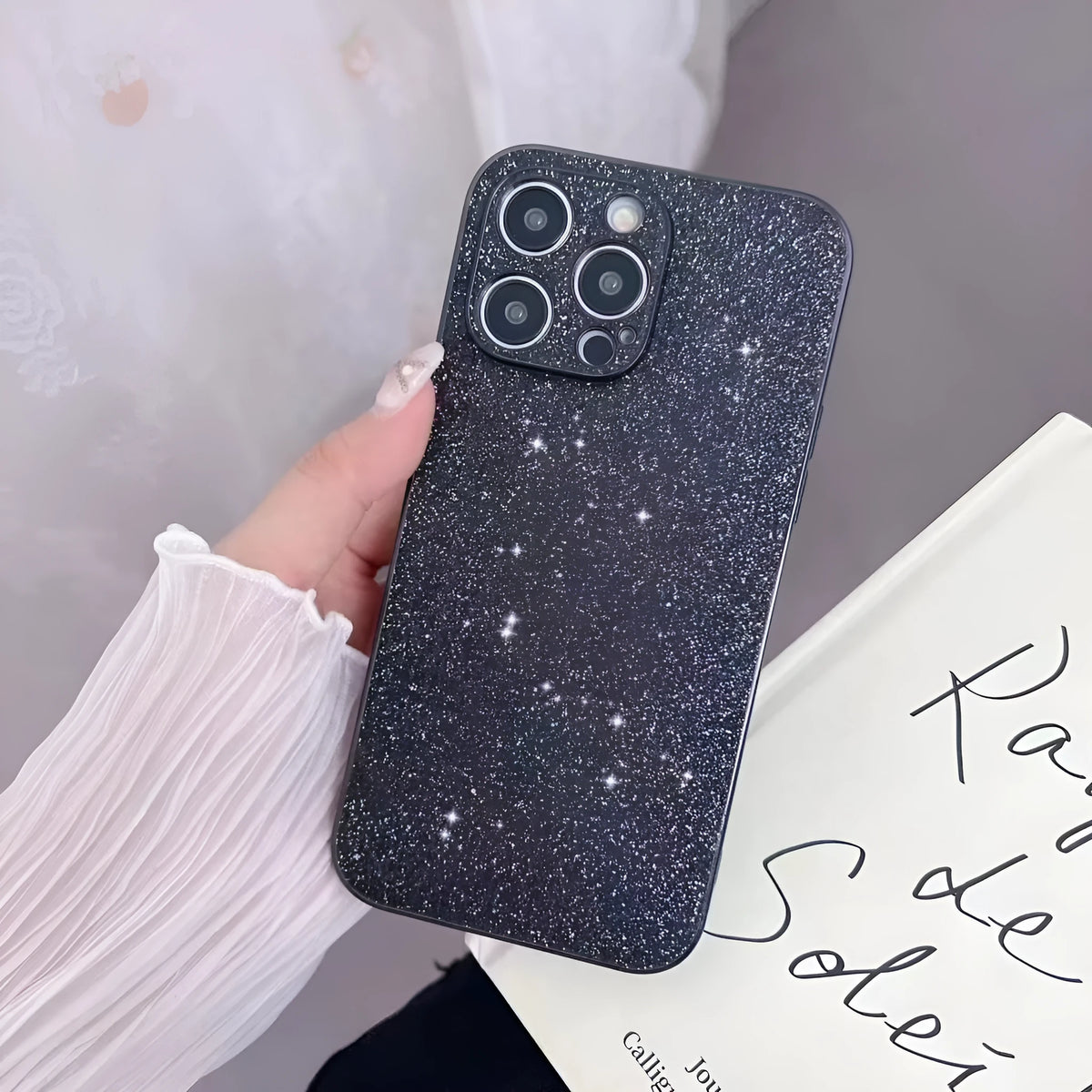 Glitter phone case for iPhone 14 Pro Max in black shell with electroplated finish, imitation leather back