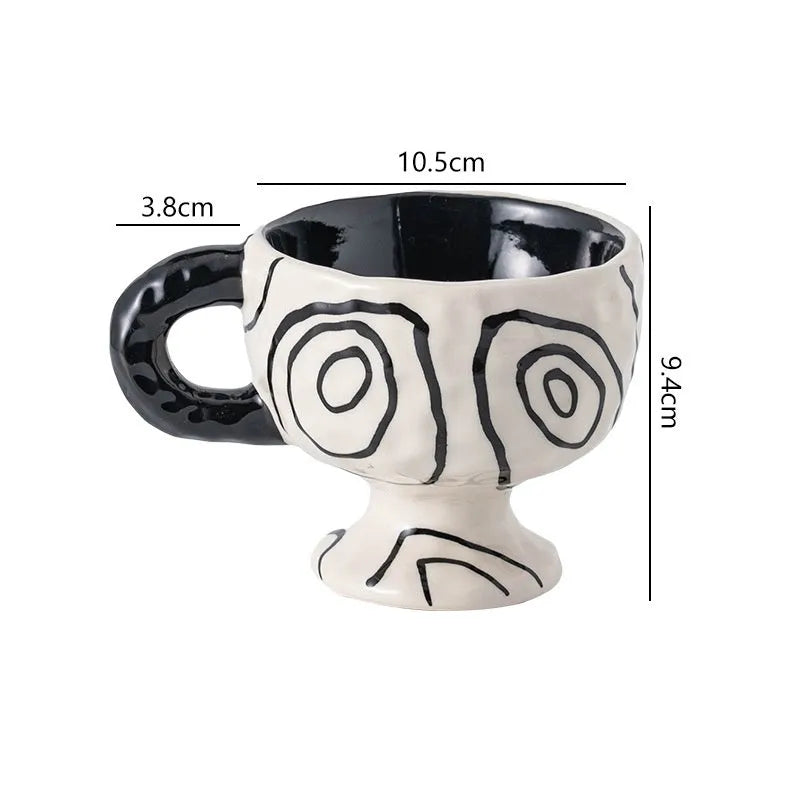 Hand-pinched irregular ceramic mug showing solid colour and unique shape
