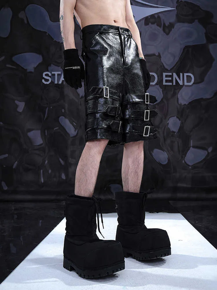 Men's black PU leather casual cropped pants with a medium-low waist on a model.