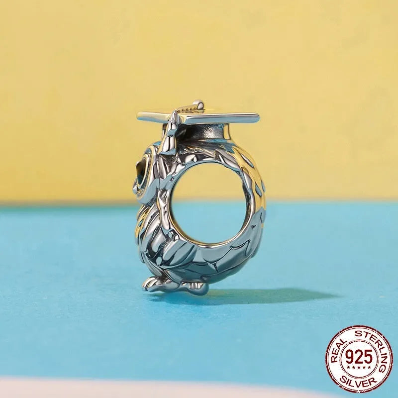 Silver S925 sterling silver owl bead with drip oil finish on white background