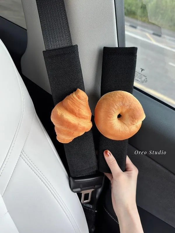 Toast bread safety belt shoulder pad in white toast colour on a car seat belt for driving comfort
