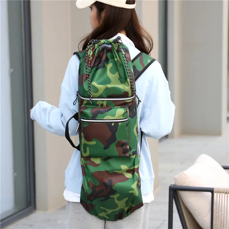 Lightweight waterproof nylon skate backpack in camouflage colour, shown with skateboard and fishing rod.