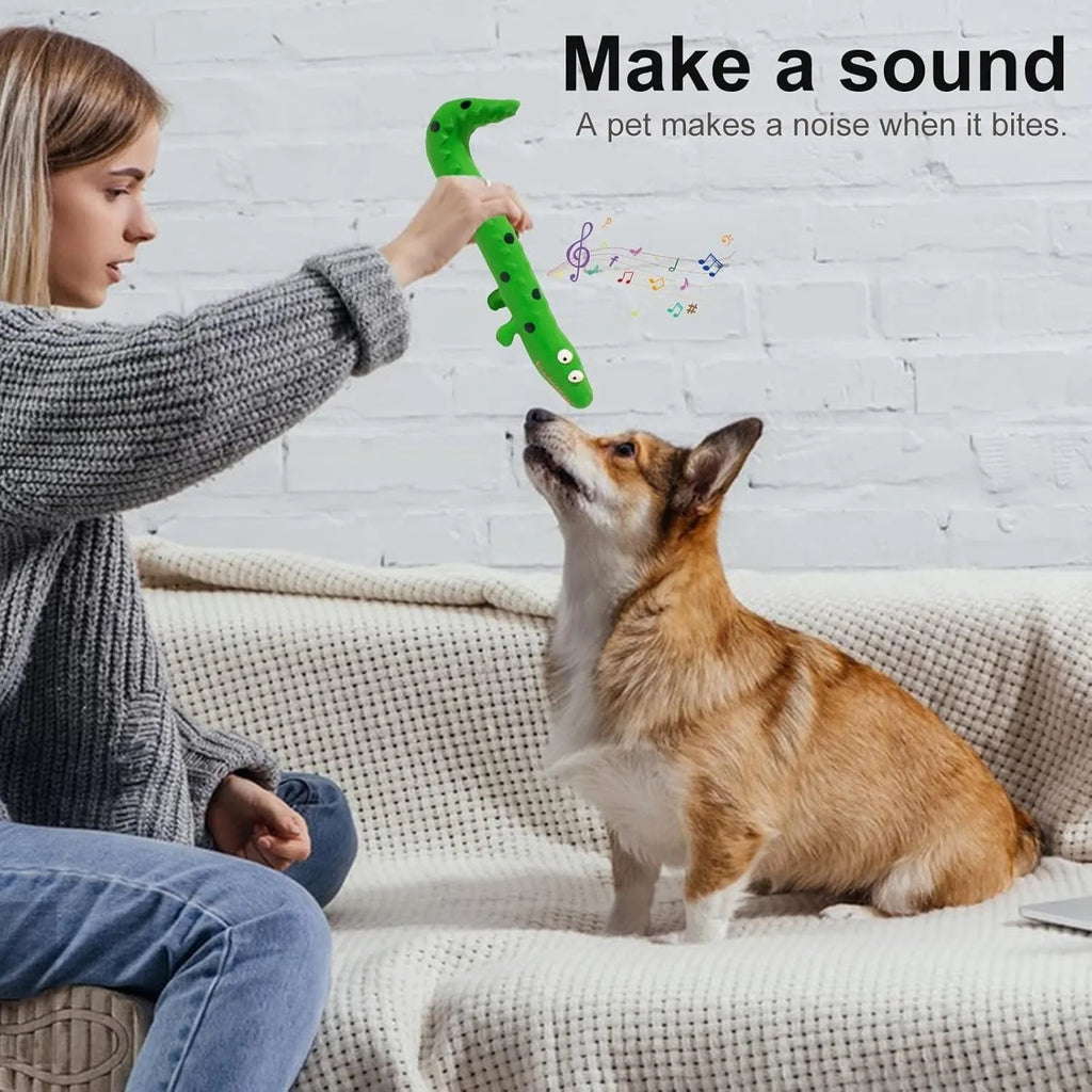Green lizard-shaped dog chew toy with textured surface and squeaker for teeth cleaning