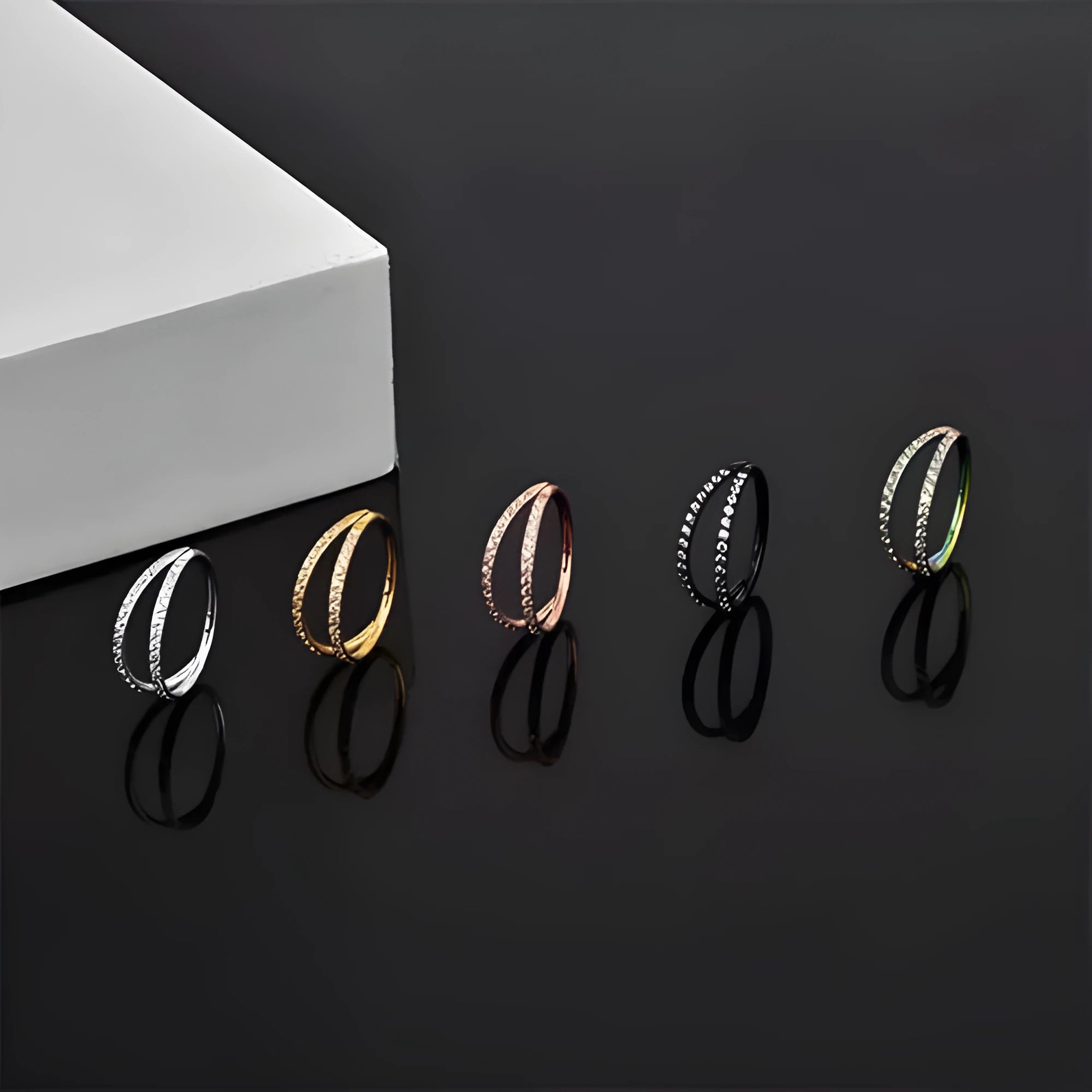 Titanium alloy nose ring with diamond coating in gold colour, showing gauge thickness and length measurements