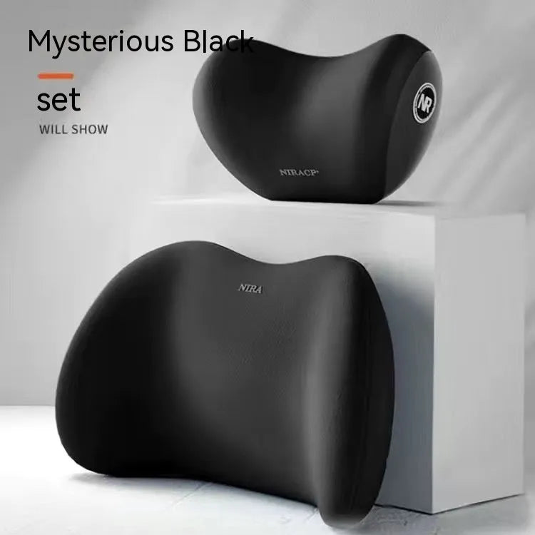 Black memory foam car lumbar support pillow and matching headrest pillow on a car seat.