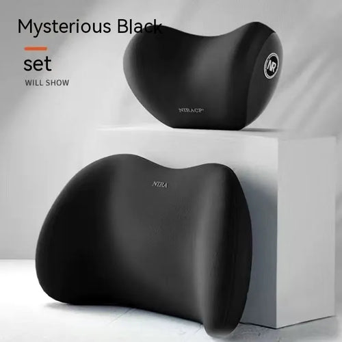 Black memory foam car lumbar support pillow and matching headrest pillow on a car seat.
