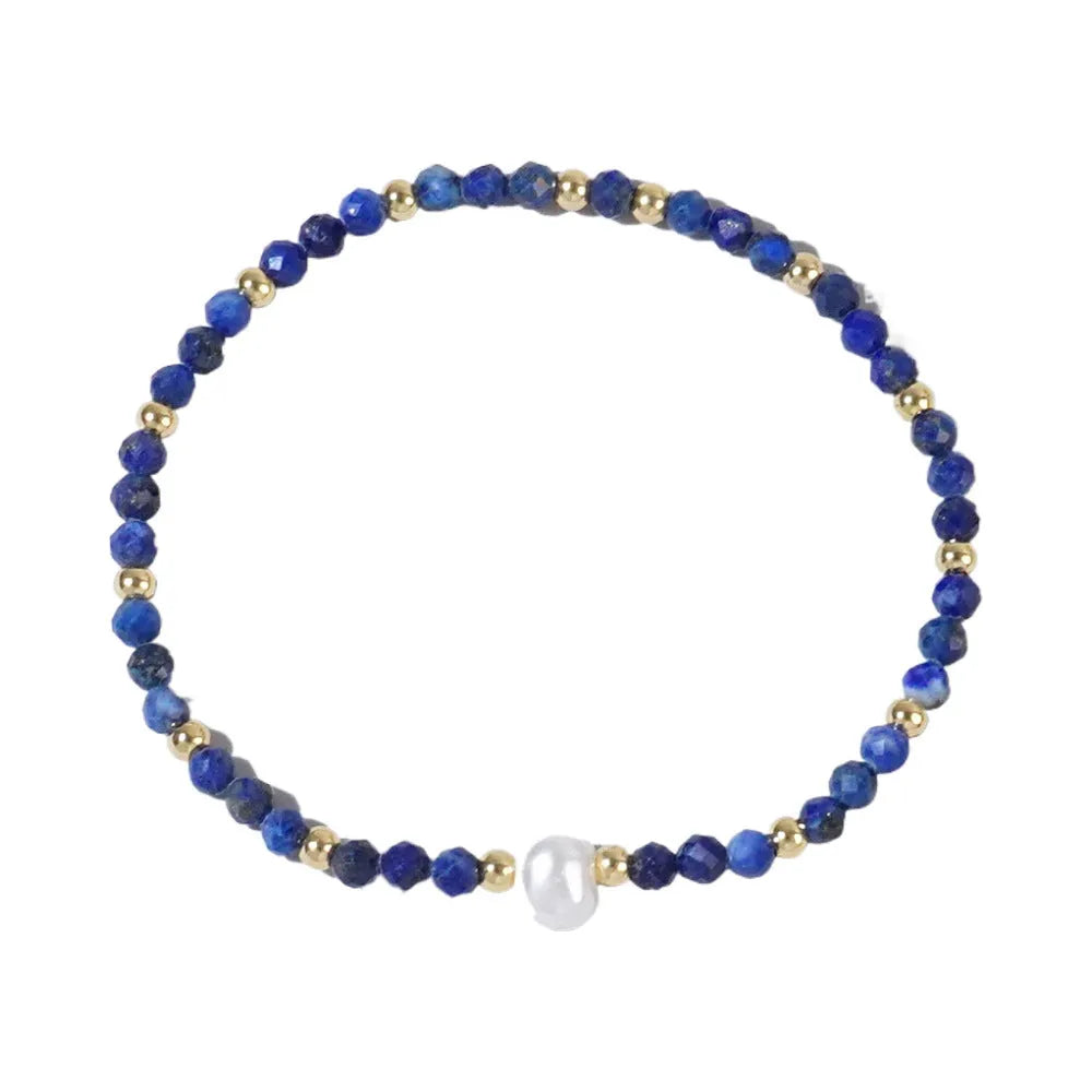 Close-up of a unisex natural stone bracelet with geometric ellipse beads on a wrist.