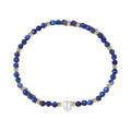 Close-up of a unisex natural stone bracelet with geometric ellipse beads on a wrist.