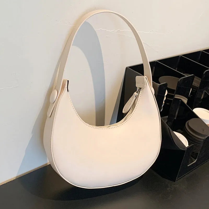 Retro women's dumpling-shaped shoulder bag in PU material with zippered compartment