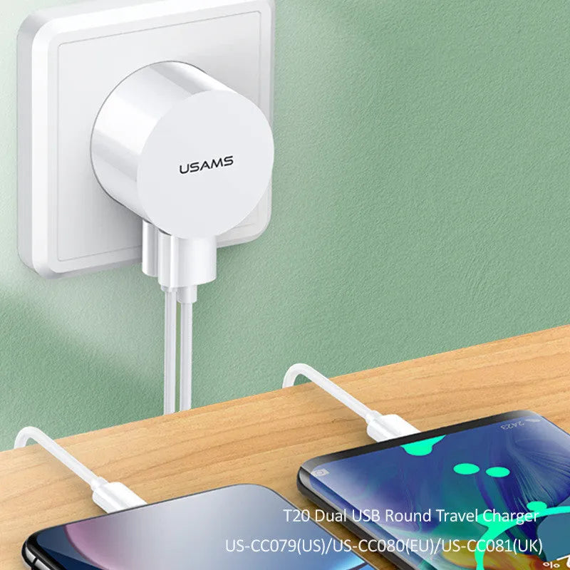 White portable universal dual USB phone charger showing US, EU and UK plug compatibility