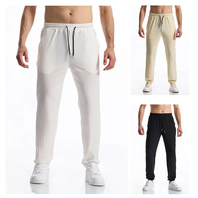 Men's black silky rib fabric casual trousers with baggy straight leg and elastic waistband
