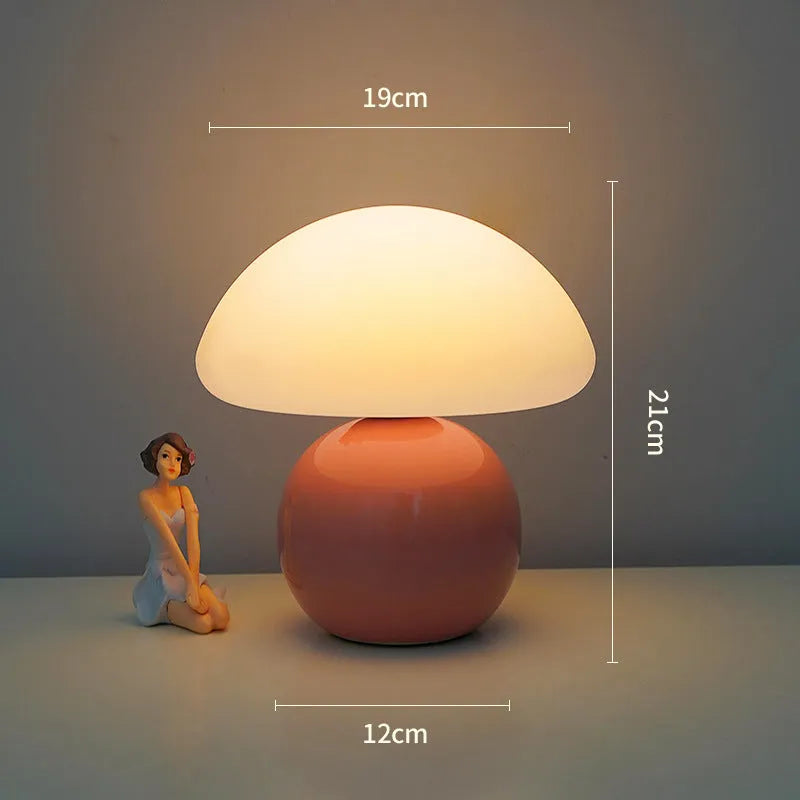 Cream ceramic mushroom table lamp with USB power cord on a bedside table, available in yellow