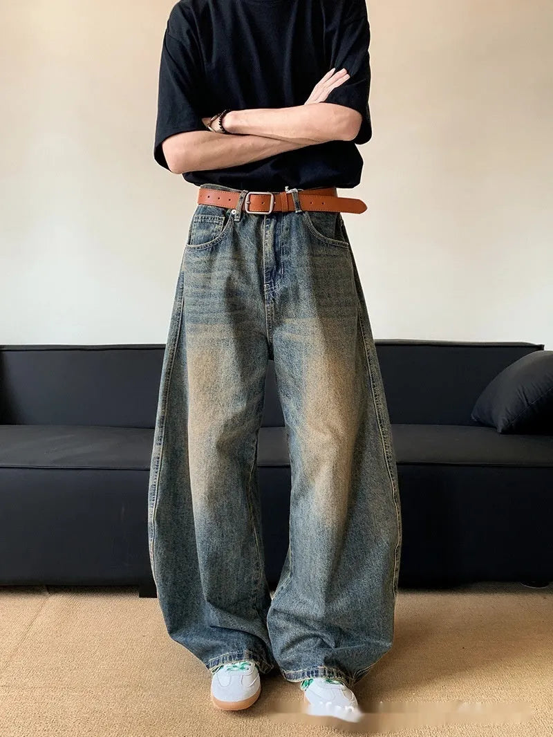 Men's retro blue distressed denim jeans with machete detailing and wide-leg fit