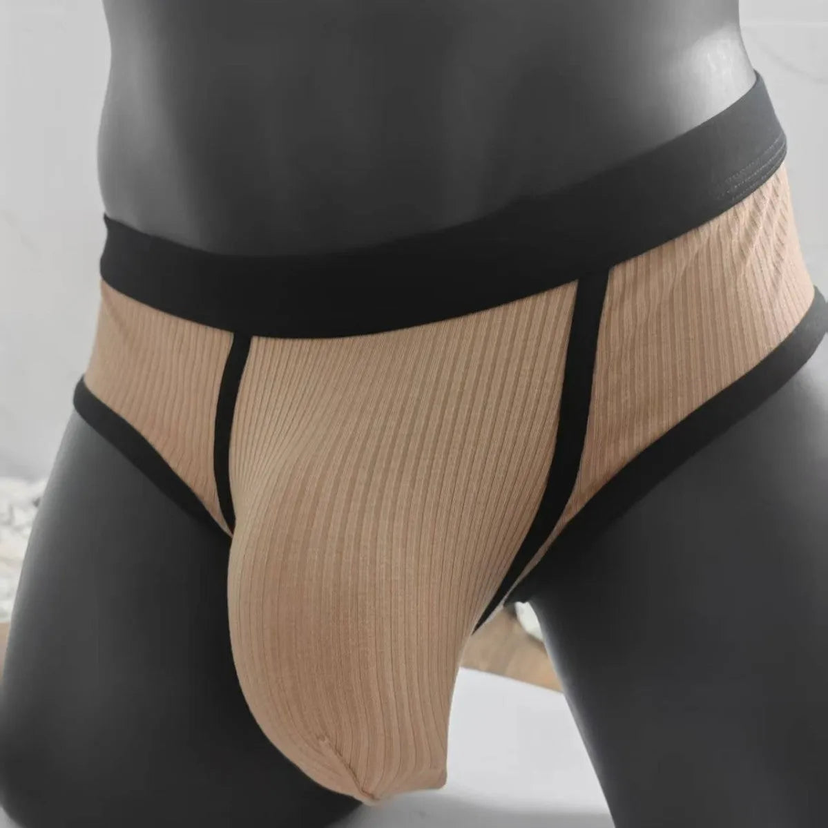 Men's black U-shaped underwear with triangle pouch design showing knitted viscose fabric texture