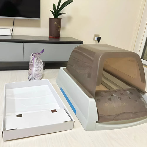 Automatic litter box replacement tray with 3 boxes of crystal litter in plastic packaging