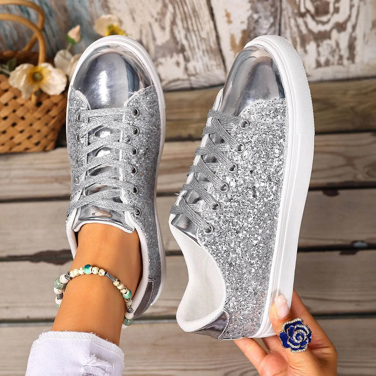Women's black plus size board shoes with sequin detailing and white front lace-up fastening on a rubber sole.