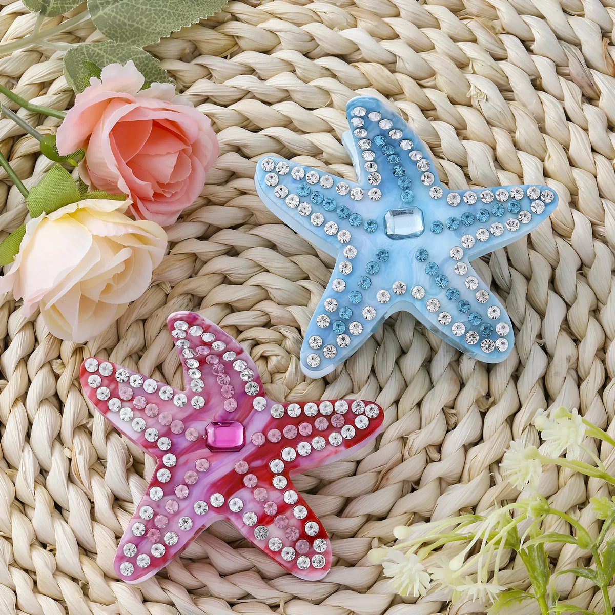 Blue acrylic starfish hairpin with diamond-encrusted surface on white background