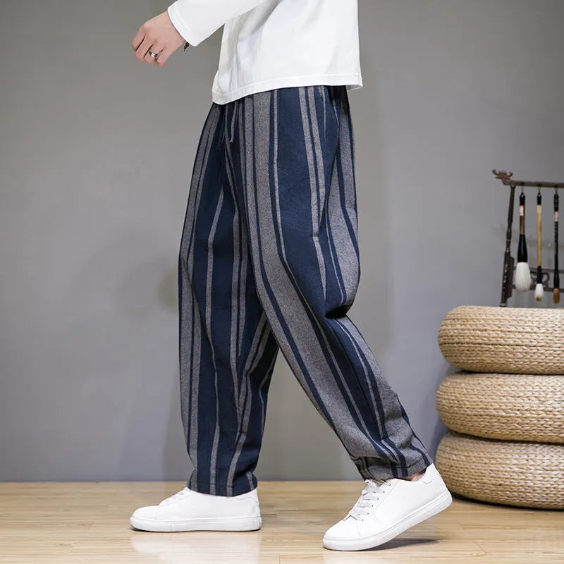 Men's striped casual trousers in black and navy blue options showing mid waist design