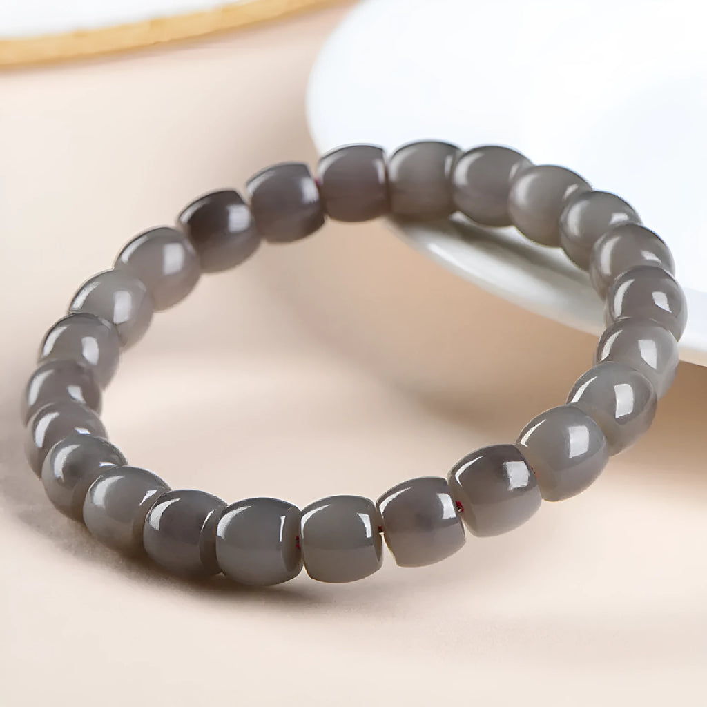 Smokey violet Hetian jade straight cut bracelet with 8x9mm beads on wrist