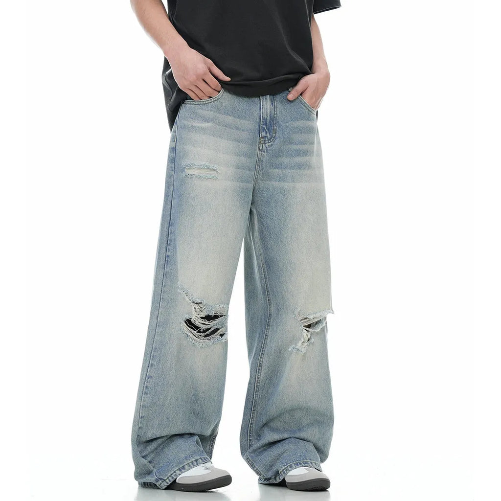 Blue cotton blend men's straight leg jeans with retro ripped detailing, front view, zipper fly, standing pose