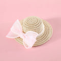 Woven straw cat hat with a pearl bow, shown in blue, pink, purple, and white colour options