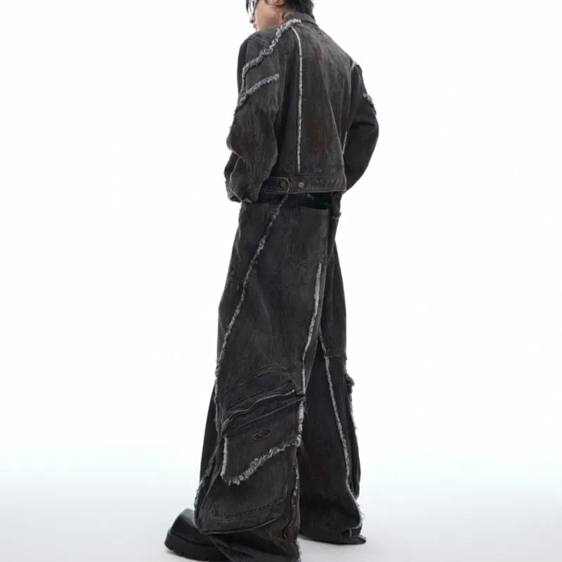 Black distressed denim coat and pants set with a gradient pattern and padded shoulders.