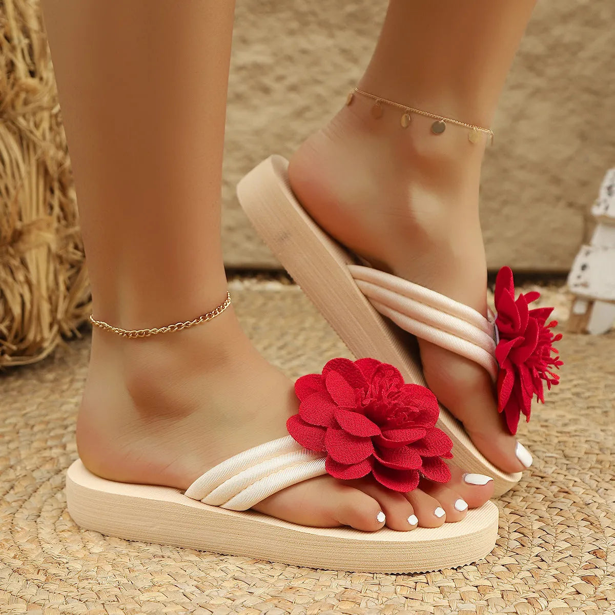 Women's solid colour PU flower flip-flops on a flat surface, showing the strap with decorative flower detail