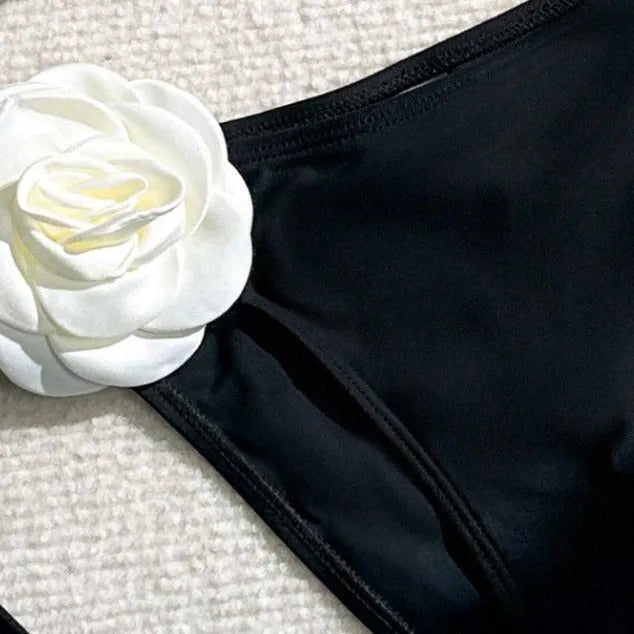 Black women's bikini swimsuit with 3D flower pattern and drawstring lace detailing on two-piece swimwear