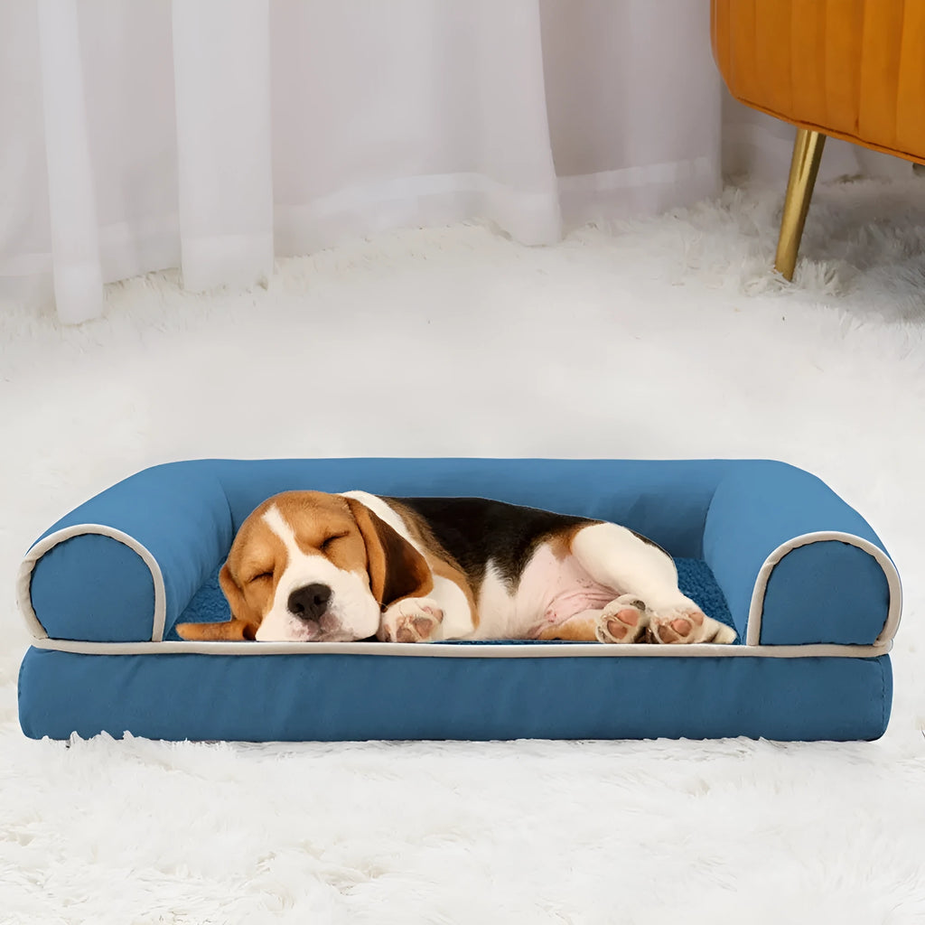 Square sponge dog bed in blue colour showing raised breathable design and cloth cover.