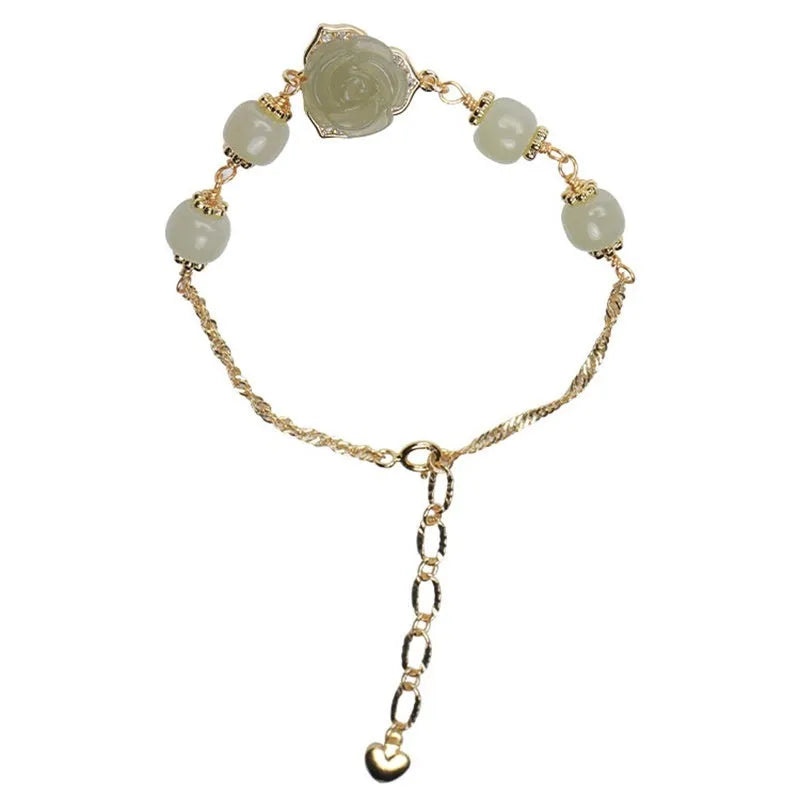 Handmade women's bracelet with rose-coloured Hetian Jade and 14K gold-plated finish in a floral design.