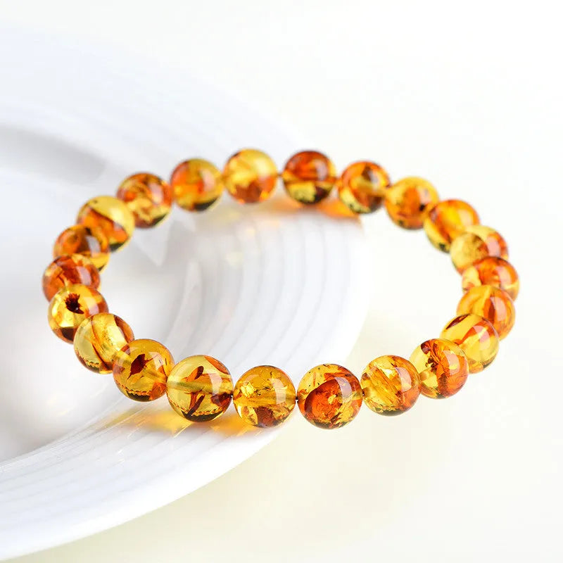 Natural yellow piebald amber bracelet with geometry beads showing flower spot patterns