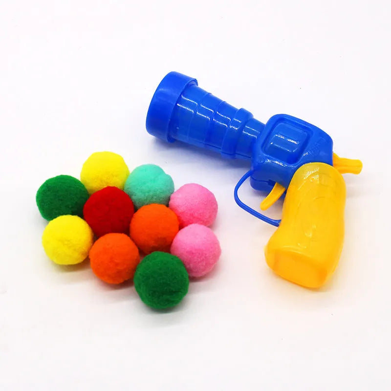 Plush ball shooter gun pet toy with multiple yarn balls for interactive fetch games