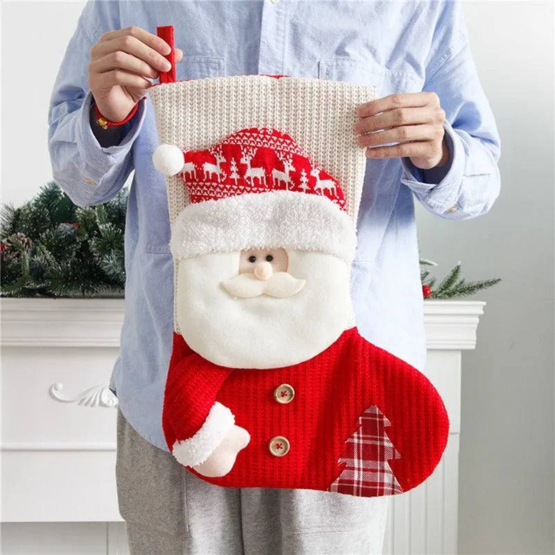 Large red and white knitted Christmas stocking with Santa Claus design for fireplace decor