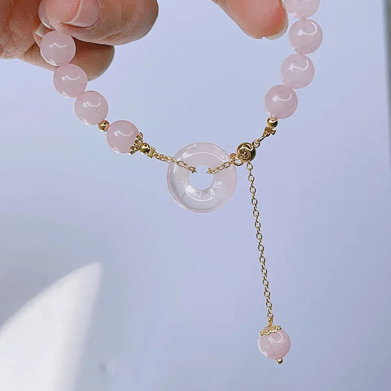 Pink crystal peace buckle bracelet with safety closure for women, adjustable design