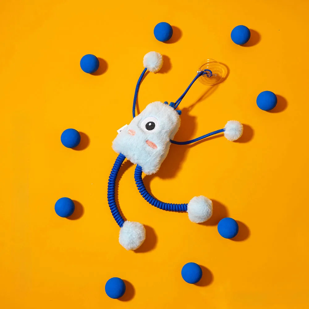 Blue plush elastic cat toy with bell in a ring shape on a light background