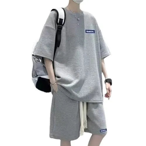 Men's waffle-textured grey leisure sports suit set with short sleeve top and shorts on a hanger
