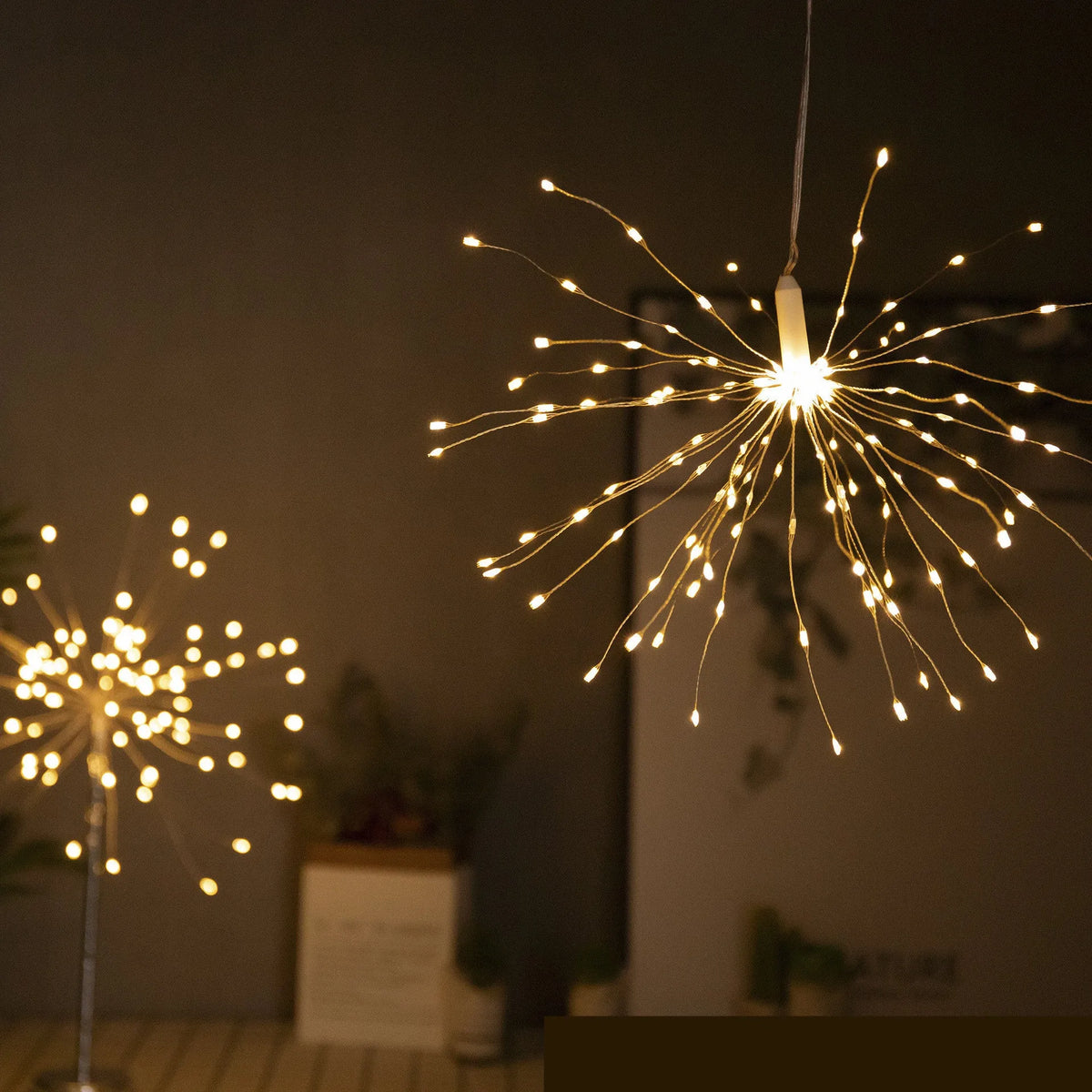 Outdoor waterproof dandelion string lights with warm colour glow on a garden fence